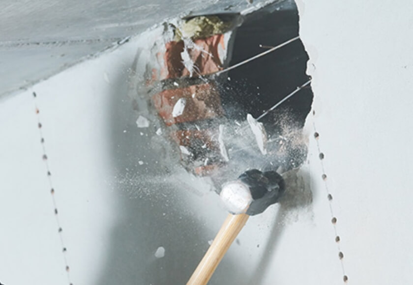 What tools do I need to knock down an interior wall?