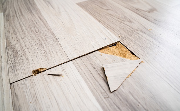 Damaged laminate flooring plank